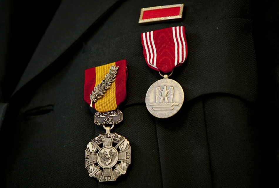 The Republic of Vietnam Gallantry Cross with Palm Device, left, and the U.S. Army Good Conduct Medal hang from Gordon Oeming's uniform after a presentation on Saturday, July 21, 2012, at Silverbrook Manor in Niles, Mich. (James Brosher/South Bend Tribune)