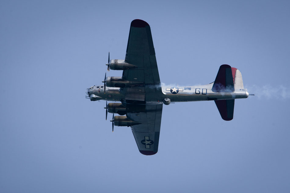 A Boeing B-17 flying fortress bomber flies over the beach during a WWII re-enactment on Saturday, June 30, 2012, at Tiscornia Beach in St. Joseph, Mich. (James Brosher/South Bend Tribune)