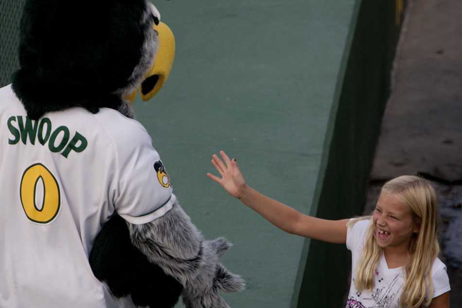 Silver Hawks mascot Swoop greets a fan during a minor league game on Wednesday, Aug. 15, 2012, at Coveleski Stadium in downtown South Bend. (James Brosher/South Bend Tribune)