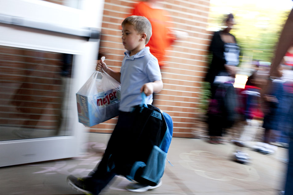 First graders make their way into the school during the first day of class at Tarkington Traditional School on Wednesday, Aug. 22, 2012, morning in South Bend. (James Brosher/South Bend Tribune)