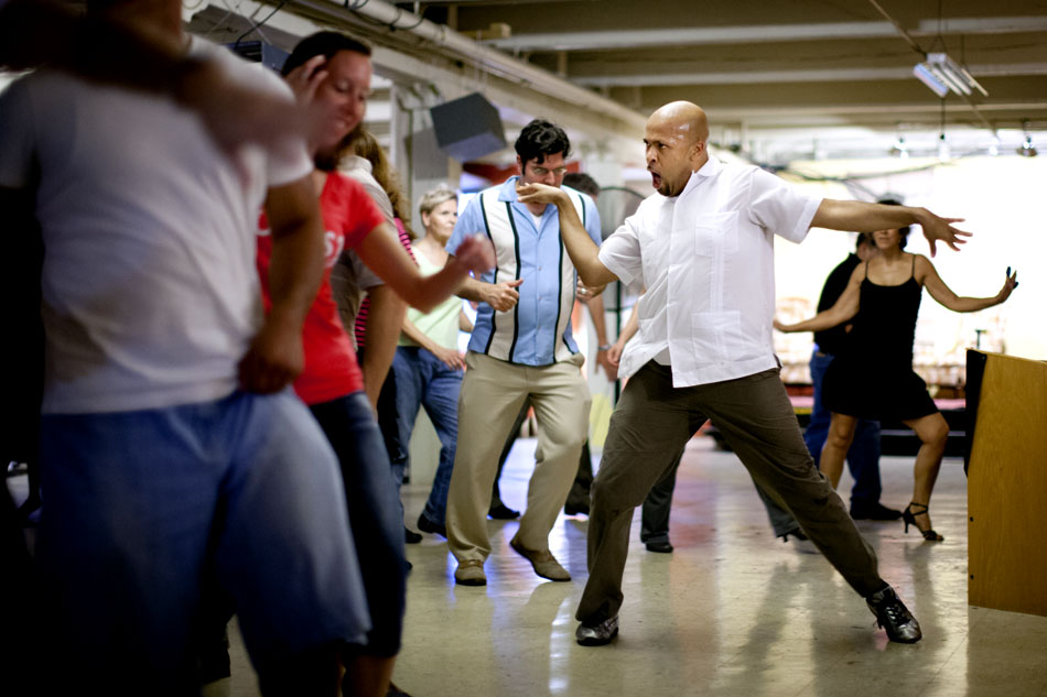 David Seymour demonstrates a salsa dance during a Latin Wednesday Dance Social on Wednesday, Sept. 5, 2012, at the LangLab in South Bend. (James Brosher/South Bend Tribune)