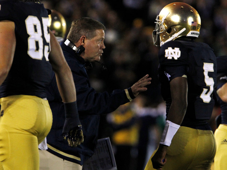 Notre Dame head coach Brian Kelly talks with quarterback Everett Golson after Golson threw an interception during a NCAA college football game on Saturday, Sept. 22, 2012, at Notre Dame. (James Brosher/South Bend Tribune)