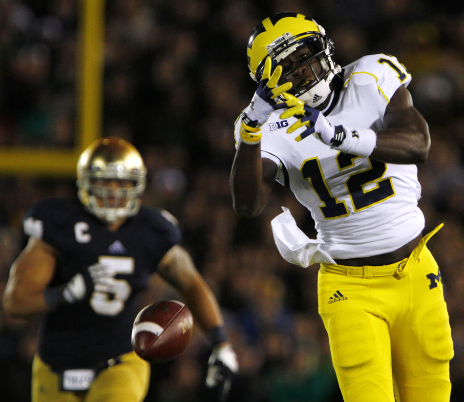 The ball flies just out of reach of Michigan wide receiver Devin Gardner during a NCAA college football game on Saturday, Sept. 22, 2012, at Notre Dame. (James Brosher/South Bend Tribune)