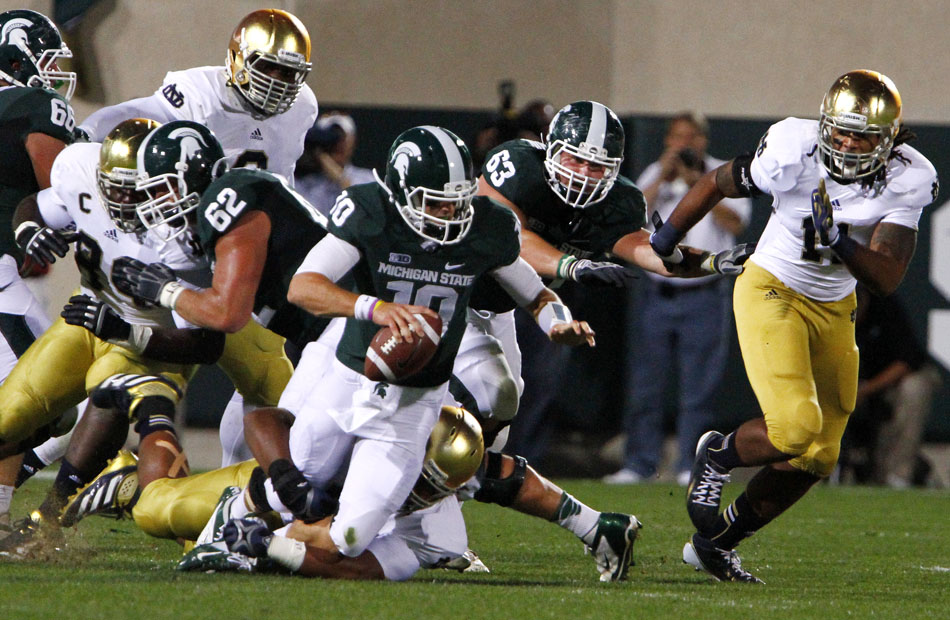 Notre Dame defensive end Sheldon Day sacks Michigan State quarterback Andrew Maxwell during a NCAA college football game on Saturday, Sept. 15, 2012, in East Lansing, Mich. (James Brosher/South Bend Tribune)