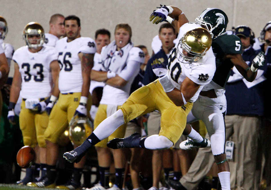 The ball falls incomplete as Notre Dame tight end Tyler Eifert works against Michigan State cornerback Johnny Adams (5) during a NCAA college football game on Saturday, Sept. 15, 2012, in East Lansing, Mich. Adams was flagged for pass interference on the play. (James Brosher/South Bend Tribune)