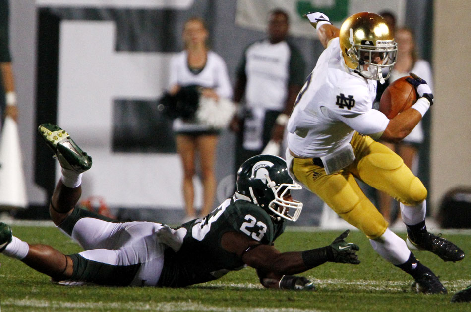 Notre Dame wide receiver Robby Toma (9) makes a cut to avoid Michigan State safety Jairus Jones (23) during a NCAA college football game on Saturday, Sept. 15, 2012, in East Lansing, Mich. (James Brosher/South Bend Tribune)