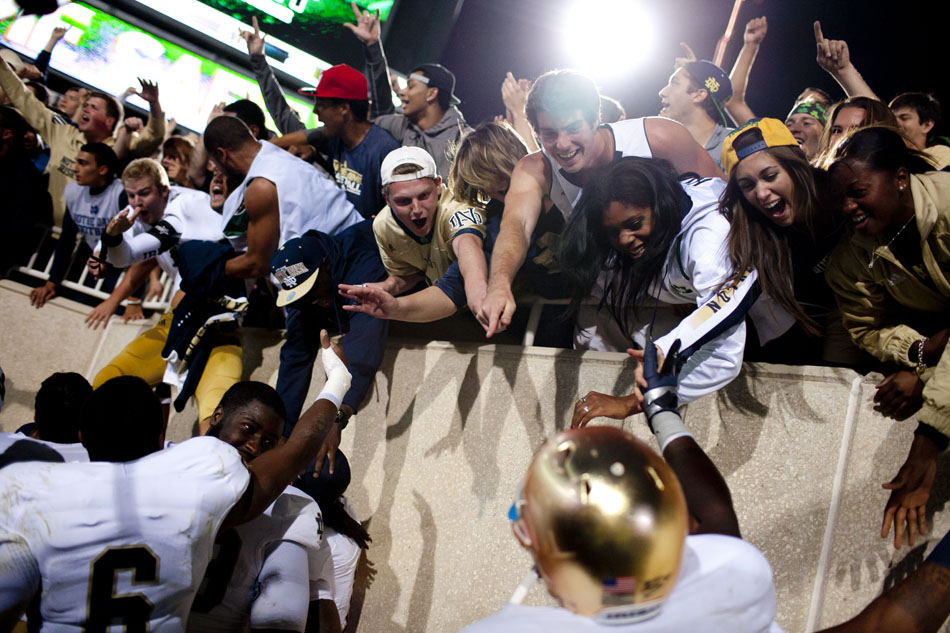 Notre Dame players celebrate with fans after a 20-3 win against Michigan State on Saturday, Sept. 15, 2012, in East Lansing, Mich. (James Brosher/South Bend Tribune)