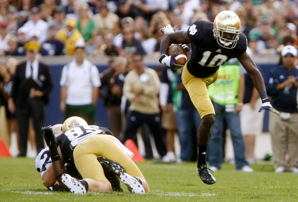 Notre Dame wide receiver DaVaris Daniels (10) goes airborne for a moment as he makes a cut to get into space after a reception during a NCAA college football game on Saturday, Sept. 8, 2012, at Notre Dame. (James Brosher/South Bend Tribune)
