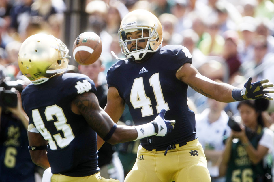 Notre Dame safety Matthias Farley (41) and cornerback Josh Atkinson (43) watch as a punt falls during a NCAA college football game on Saturday, Sept. 8, 2012, at Notre Dame. (James Brosher/South Bend Tribune)