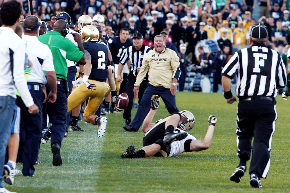 Notre Dame head coach Brian Kelly yells at cornerback Bennett Jackson (2) after he caught and returned a hail mary pass at the end of the game to seal a win for the Irish during a NCAA college football game on Saturday, Sept. 8, 2012, at Notre Dame. (James Brosher/South Bend Tribune)