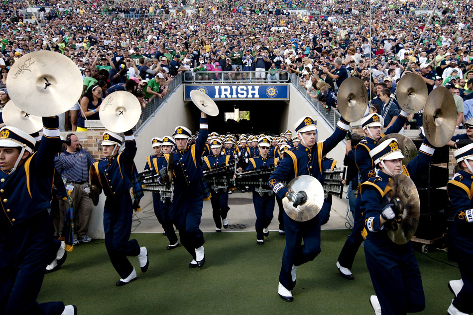 The Notre Dame marching band runs onto the field before a NCAA college football game against Purdue on Saturday, Sept. 8, 2012, at Notre Dame. (James Brosher/South Bend Tribune)