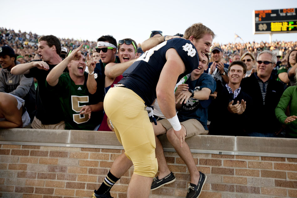Notre Dame linebacker Joe Schmidt celebrates with the crowd after a NCAA college football game on Saturday, Sept. 8, 2012, at Notre Dame. (James Brosher/South Bend Tribune)