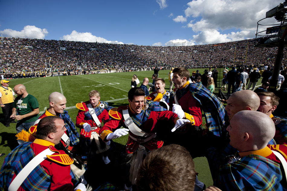 Members of the Irish Guard celebrate a touchdown in the first half of a NCAA college football game against Purdue on Saturday, Sept. 8, 2012, at Notre Dame. (James Brosher/South Bend Tribune)