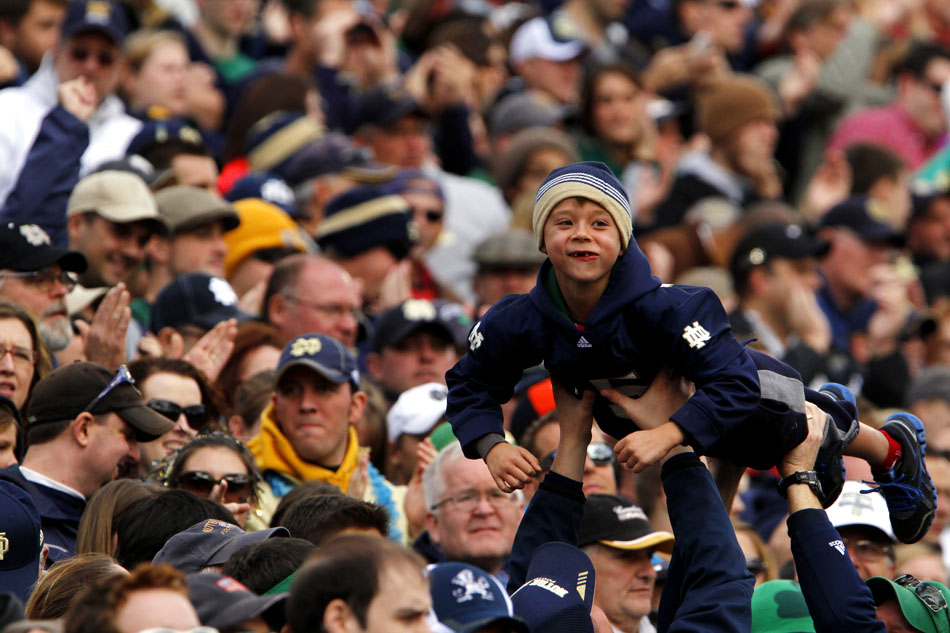 A youngster celebrates Notre Dame's first touchdown during a NCAA college football game on Saturday, Oct. 20, 2012, at Notre Dame. (James Brosher/South Bend Tribune)