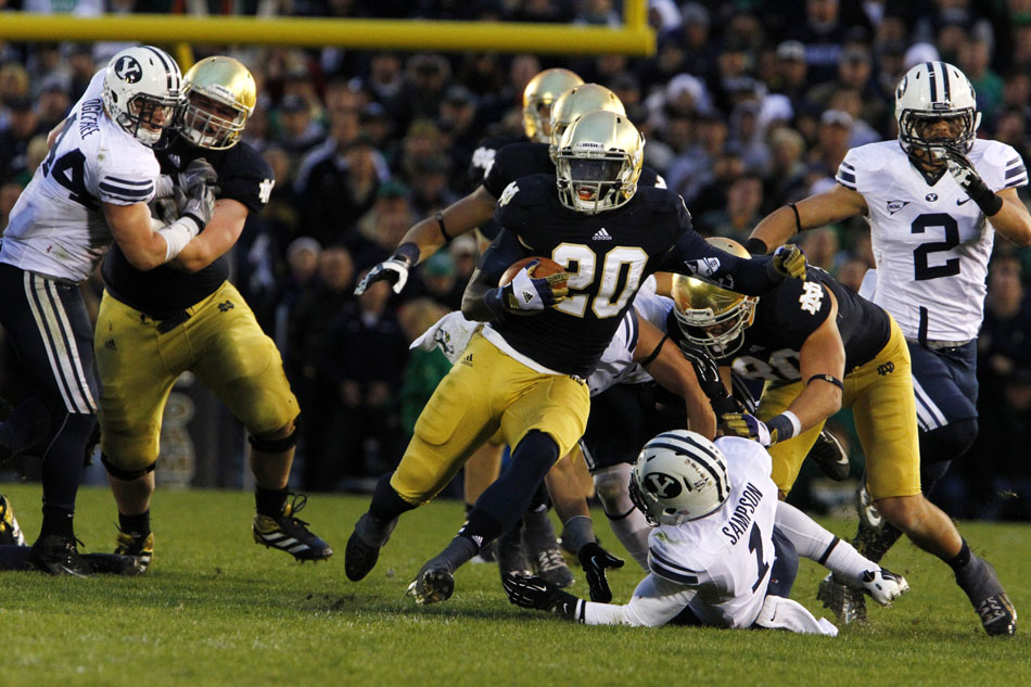 Notre Dame running back Cierre Wood (20) breaks away for a big gain on the ground during a NCAA college football game on Saturday, Oct. 20, 2012, at Notre Dame. (James Brosher/South Bend Tribune)