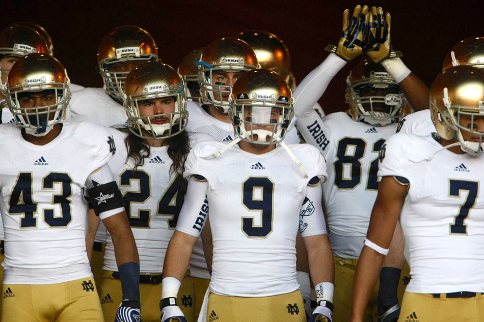 Notre Dame players wait to take the field before an NCAA college football game on Saturday, Nov. 24, 2012, at the Los Angeles Memorial Coliseum. (James Brosher/South Bend Tribune)