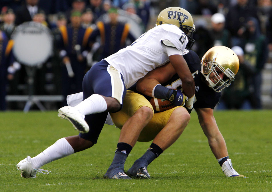 Pittsburgh defensive back K'Waun Williams (2) tackles Notre Dame tight end Tyler Eifert after a reception during an NCAA college football game on Saturday, Nov. 3, 2012, at Notre Dame. (James Brosher/South Bend Tribune)