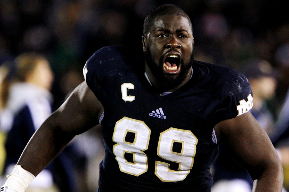 Notre Dame defensive end Kapron Lewis-Moore runs onto the field in celebration after Notre Dame held off Pittsburgh for a 29-26 win in three overtimes on Saturday, Nov. 3, 2012, at Notre Dame. (James Brosher/South Bend Tribune)