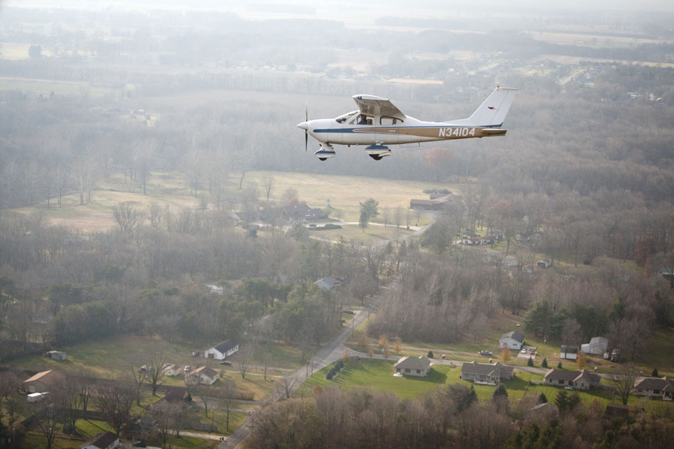Tom May, the airport manager, circles over a neighborhood bordering the Mishawaka Pilots Club Airport on Wednesday, Nov. 14, 2012, near Elkhart, Ind. (James Brosher/South Bend Tribune)