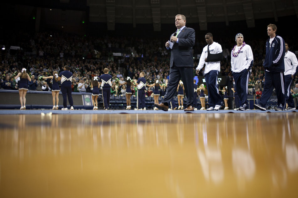 Notre Dame coach Brian Kelly leads his team into the arena during the pep rally on Friday, Nov. 16, 2012, at the Purcell Pavilion at Notre Dame. (James Brosher/South Bend Tribune)