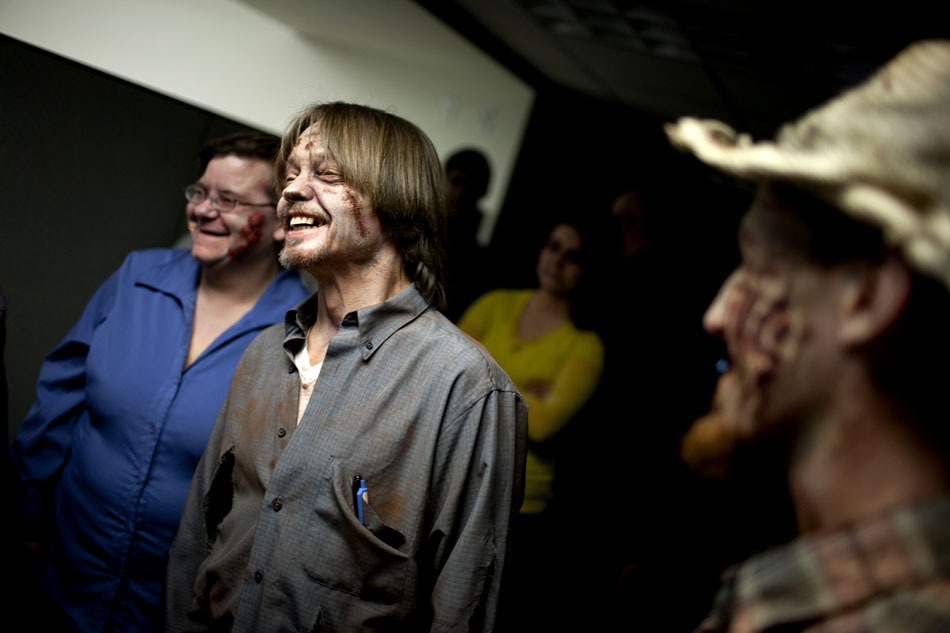 Zombie actor Dennis Davis shares a laugh with fellow cast members during a break in shooting a promotional video on Wednesday, Dec. 5, 2012, at the WNIT studios in downtown South Bend. With the promo, the show's producers are hoping to raise enough funding to create a zombie television series. (James Brosher/South Bend Tribune)