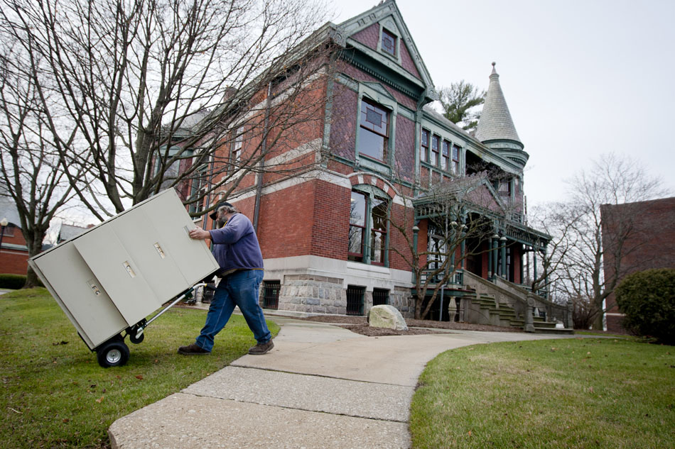 Ron Krueger, a Niles city worker, uses a hand truck to move a large filing cabinet out of the Niles City Hall, located in the former Henry Austin Chapin mansion, on Thursday, Dec. 6, 2012, in downtown Niles. Workers are in the process of moving documents, office supplies and furniture from the mansion where they have resided for decades to the former Standard-Federal Bank a few blocks away. The new location opens for business on Monday, Dec. 10. (James Brosher/South Bend Tribune)