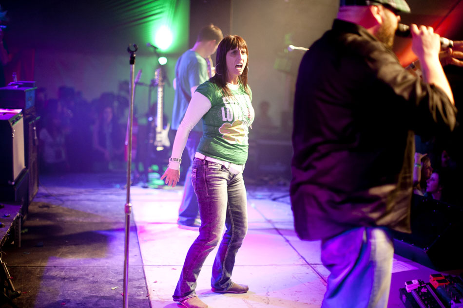 A crowd member dances on stage as Stillshot performs during the St. Paddy's Tent Party on Friday, March 15, 2013, in downtown South Bend. (James Brosher/South Bend Tribune)