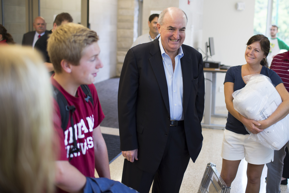 Indiana University President Michael A. McRobbie interacts with parents and students inside of Spruce Hall during Indiana University Bloomington move-in day on Wednesday, Aug. 19, 2015. (James Brosher/IU Communications)