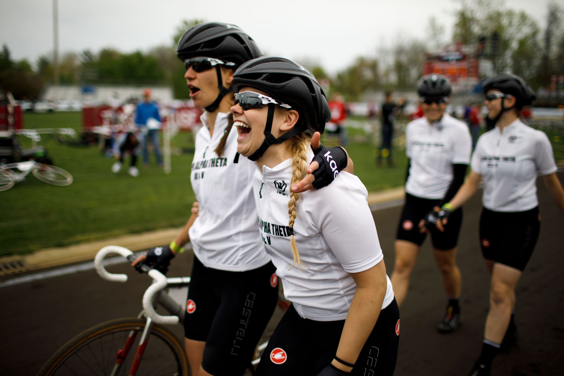 Kappa Alpha Theta's Sydney Keaton, right, shares a laugh with teammate Evelyn Malcomb as the team lines up for the parade lap before the Women's Little 500 at Bill Armstrong Stadium on Friday, April 21, 2017. (James Brosher/IU Communications)