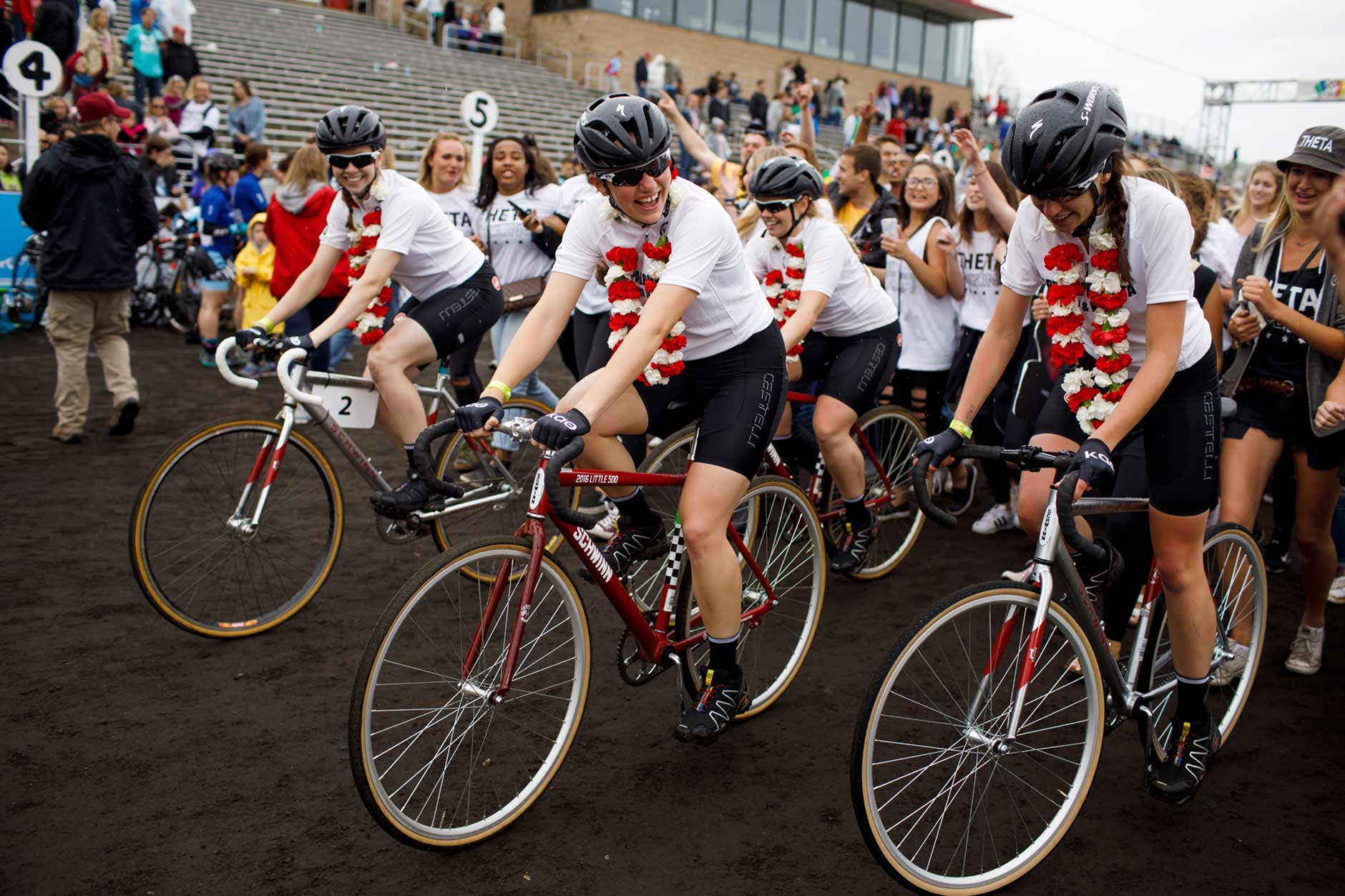 Kappa Alpha Theta riders take a victory lap around the track with their sorority sisters after the team's victory in the Women's Little 500 at Bill Armstrong Stadium on Friday, April 21, 2017. (James Brosher/IU Communications)
