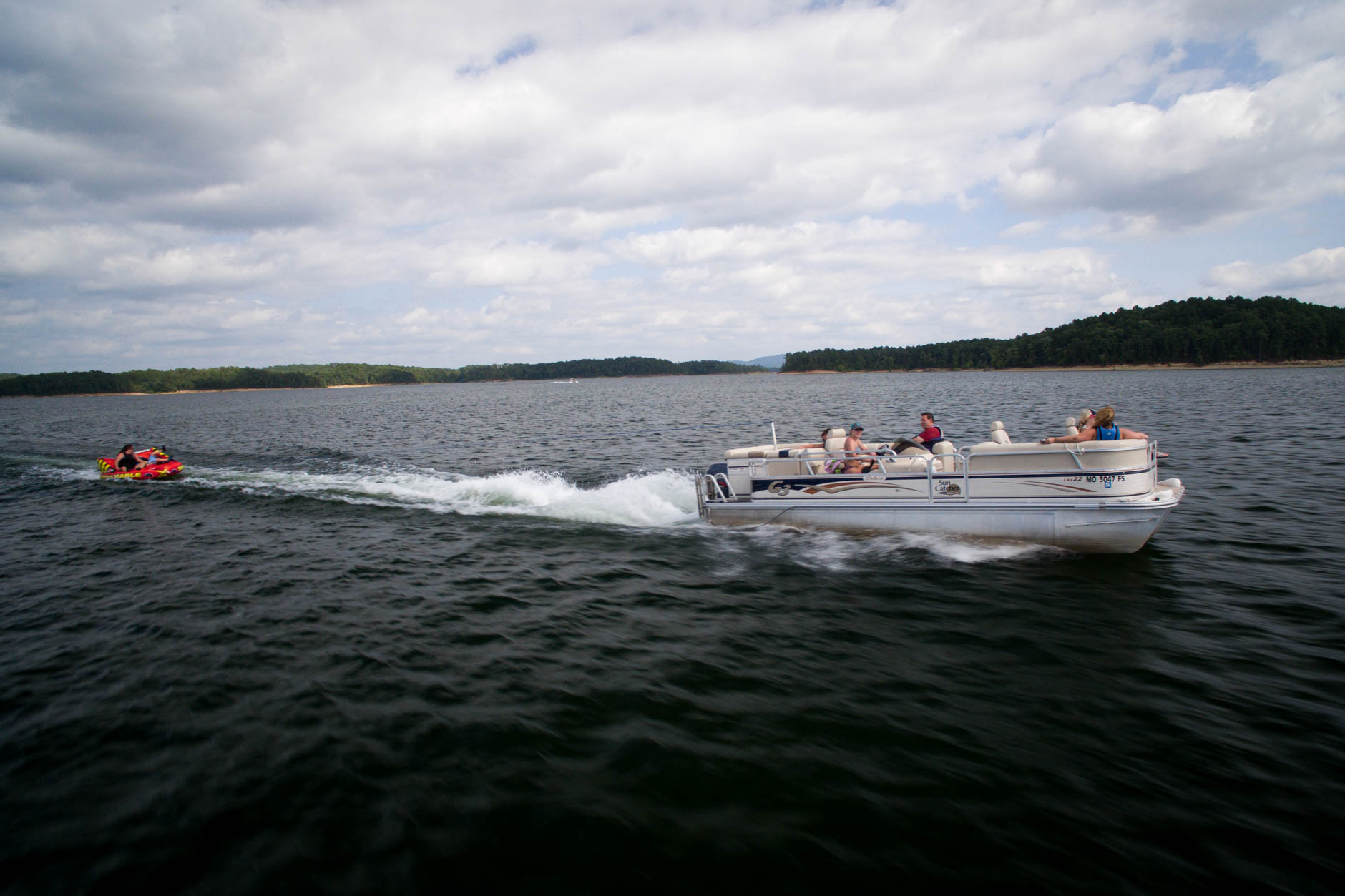 Boaters pull an inflatable towable intertube on Lake Ouachita, Arkansas on Tuesday, Aug. 21, 2018. (Photo by James Brosher)