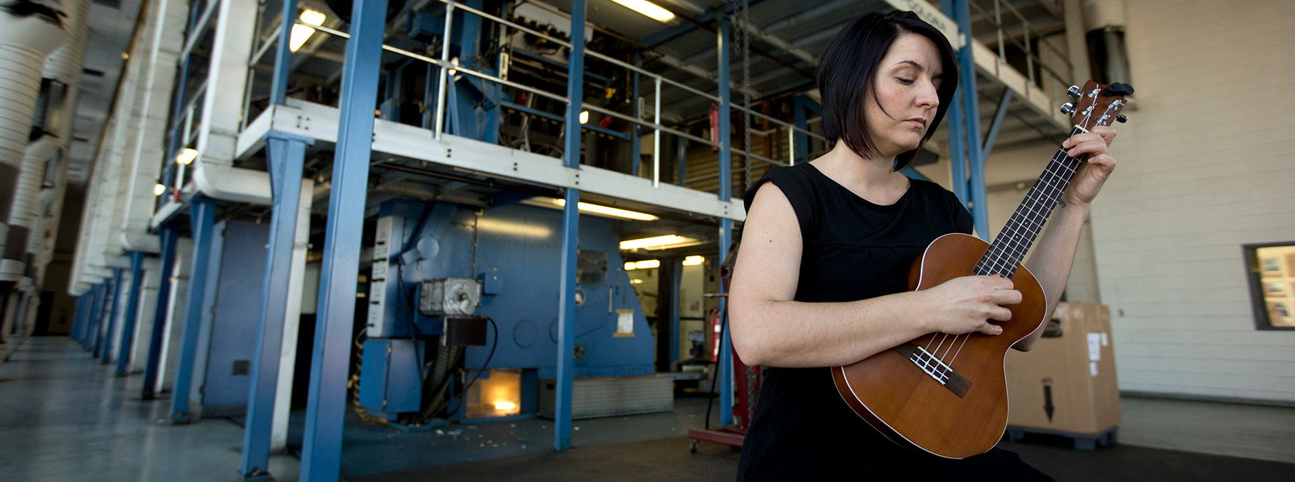 Dena Woods plays a ukulele during a performance on Monday, Feb. 3, 2014, in the South Bend Tribune press room in downtown South Bend. SBT Photo/JAMES BROSHER