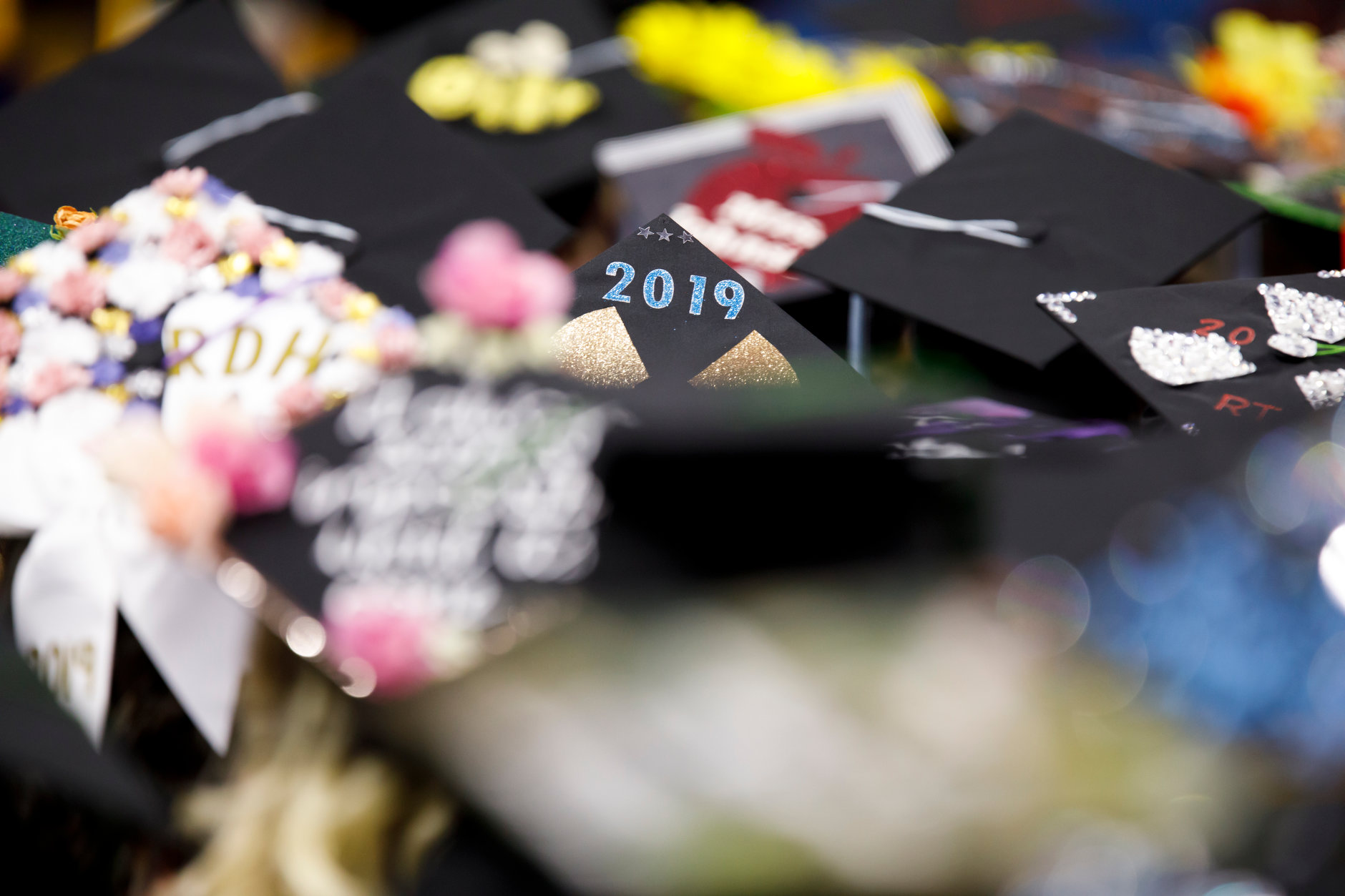 A variety of decorated mortarboards are pictured during the Indiana University South Bend Commencement at the University of Notre Dame on Tuesday, May 7, 2019. (James Brosher/Indiana University)