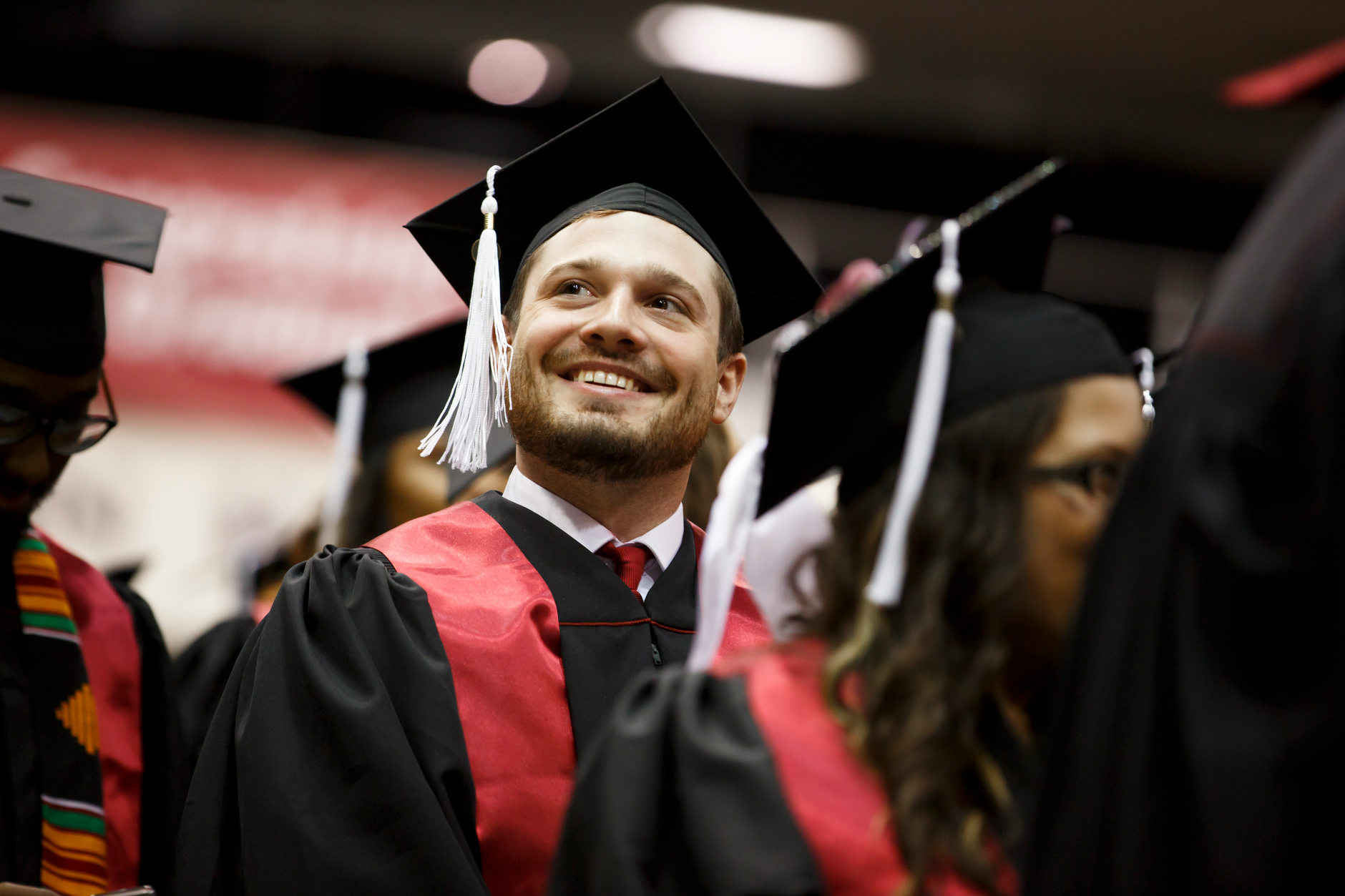 A graduate smiles before the start of the Indiana University Northwest Commencement at the Genesis Convention Center on Thursday, May 9, 2019. (James Brosher/Indiana University)