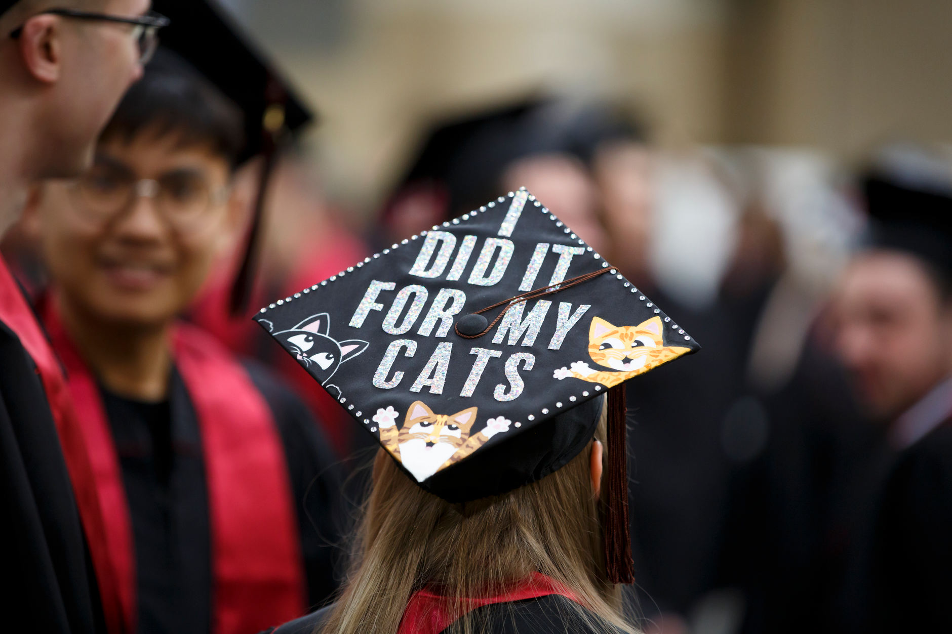 A graduate wears a decorated mortarboard before the IUPUI Commencement at Lucas Oil Stadium on Saturday, May 11, 2019. (James Brosher/Indiana University)