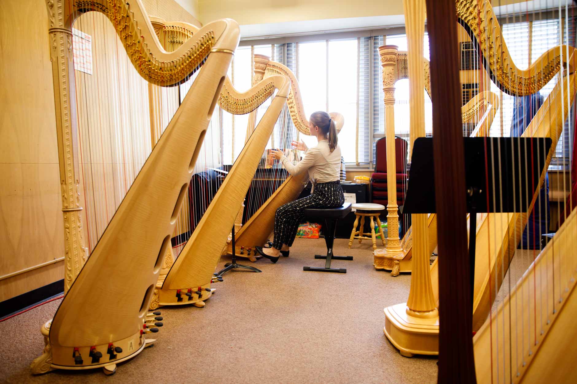 Miriam Ruf of Germany selects a harp during the 11th USA International Harp Competition at Indiana University in Bloomington, Indiana on Tuesday, July 2, 2019. (Photo by James Brosher)