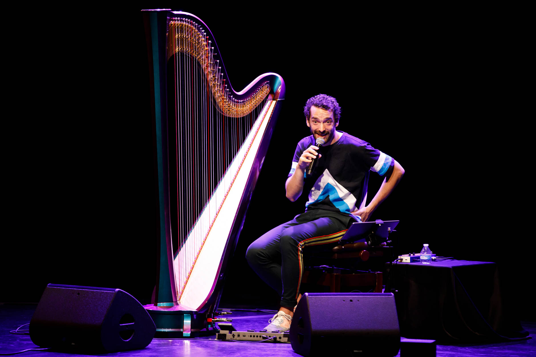 Remy van Kesteren speaks to the audience during his laureate recital at the 11th USA International Harp Competition at the Buskirk-Chumley Theater in Bloomington, Indiana on Saturday, July 6, 2019. (Photo by James Brosher)