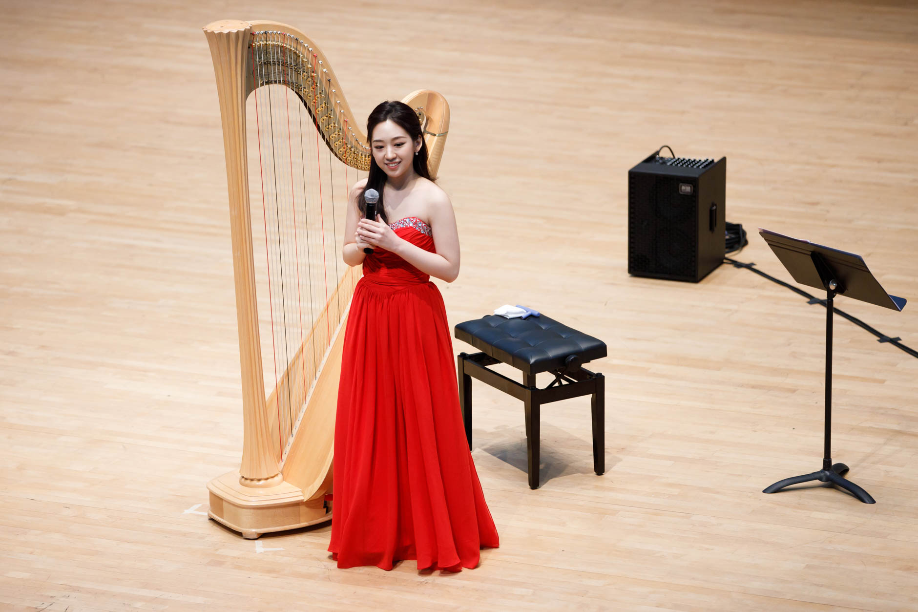 Se Hee Hwang from South Korea speaks before performing during Stage III at the 11th USA International Harp Competition at Indiana University in Bloomington, Indiana on Wednesday, July 10, 2019. (Photo by James Brosher)