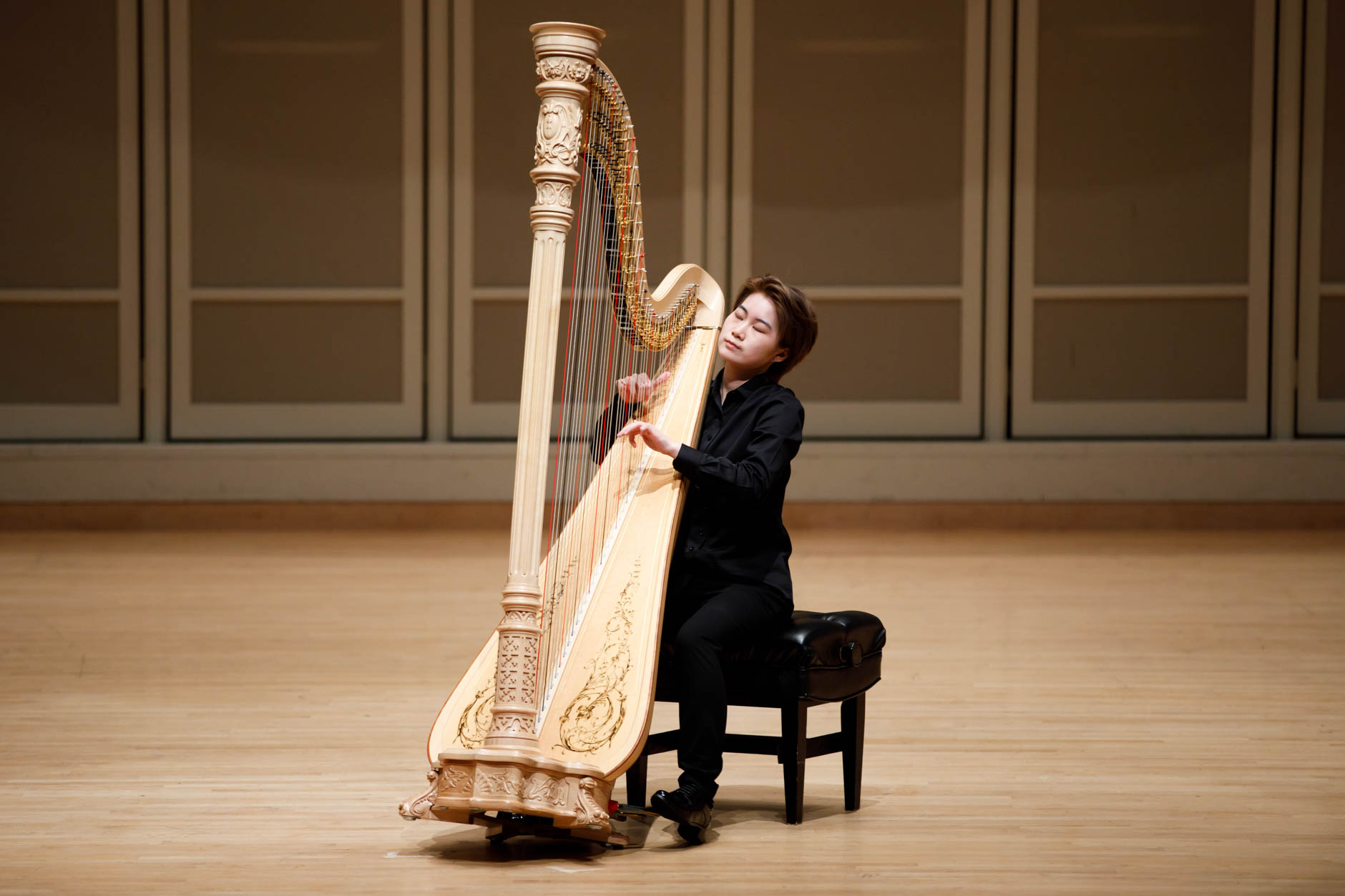 Xinyue Zhang performs during the Stars of Tomorrow Concert at the 11th USA International Harp Competition at Indiana University in Bloomington, Indiana on Thursday, July 11, 2019. (Photo by James Brosher)