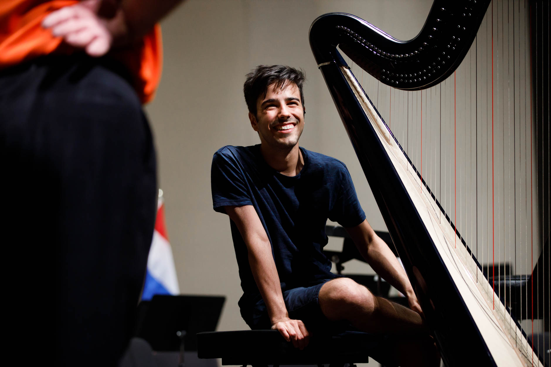 Valerio Lisci from Italy shares a laugh before an orchestra rehearsal for the Final Stage concert at the 11th USA International Harp Competition at Indiana University in Bloomington, Indiana on Friday, July 12, 2019. (Photo by James Brosher)