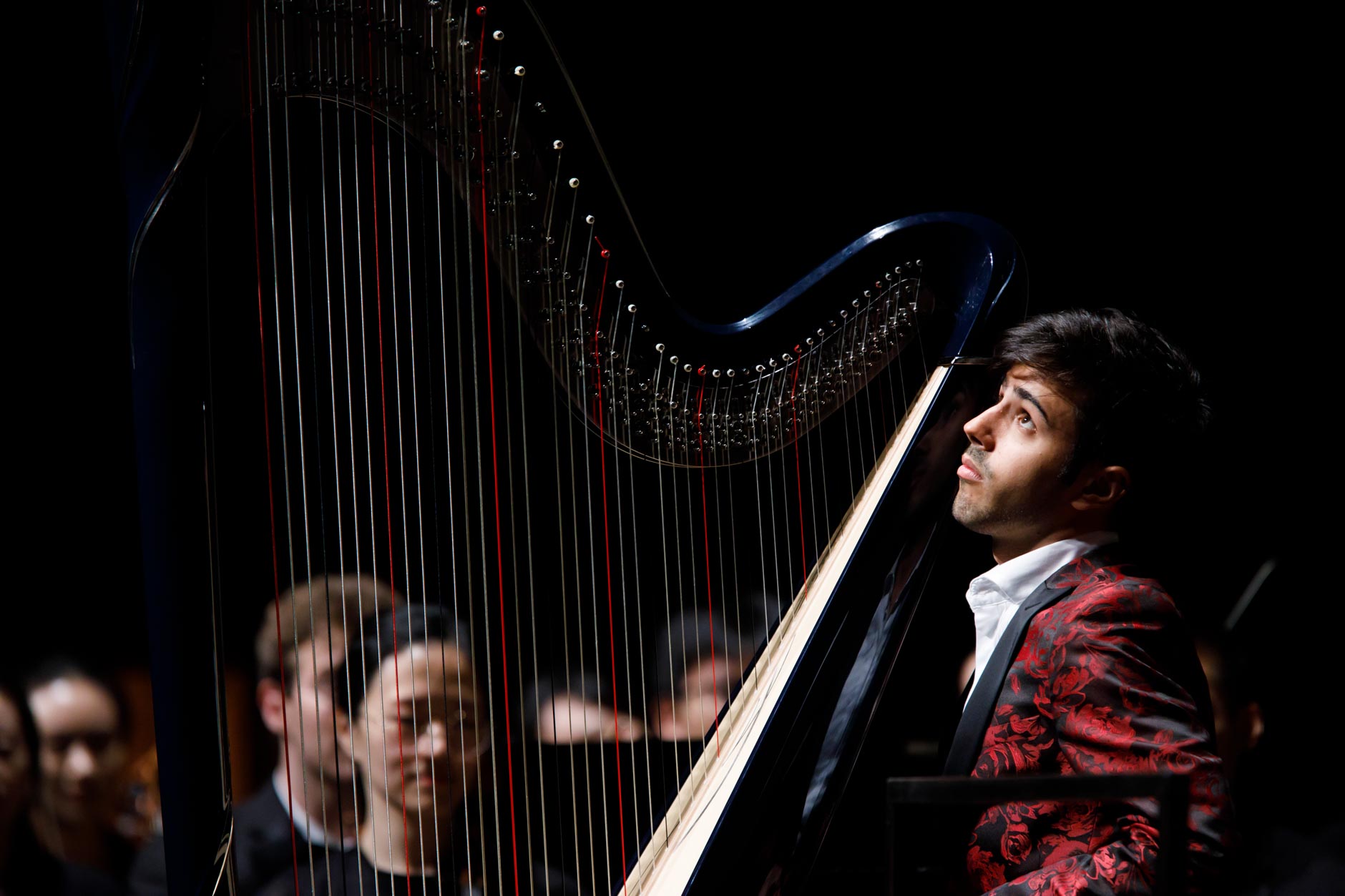 Valerio Lisci of Italy performs with the Indiana University Summer Philharmonic Orchestra during the Stage IV concert at the 11th USA International Harp Competition at Indiana University in Bloomington, Indiana on Saturday, July 13, 2019. (Photo by James Brosher)