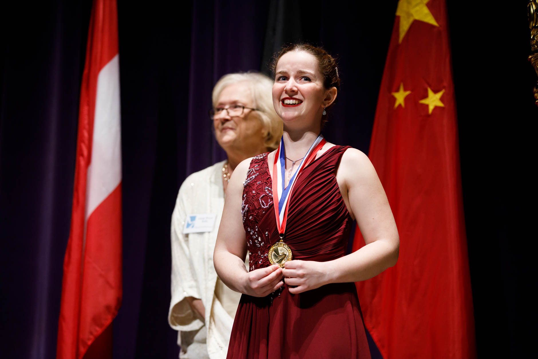 First prize winner Melanie Laurent from France receives her first-prize medal during the awards ceremony of the 11th USA International Harp Competition at Indiana University in Bloomington, Indiana on Saturday, July 13, 2019. (Photo by James Brosher)
