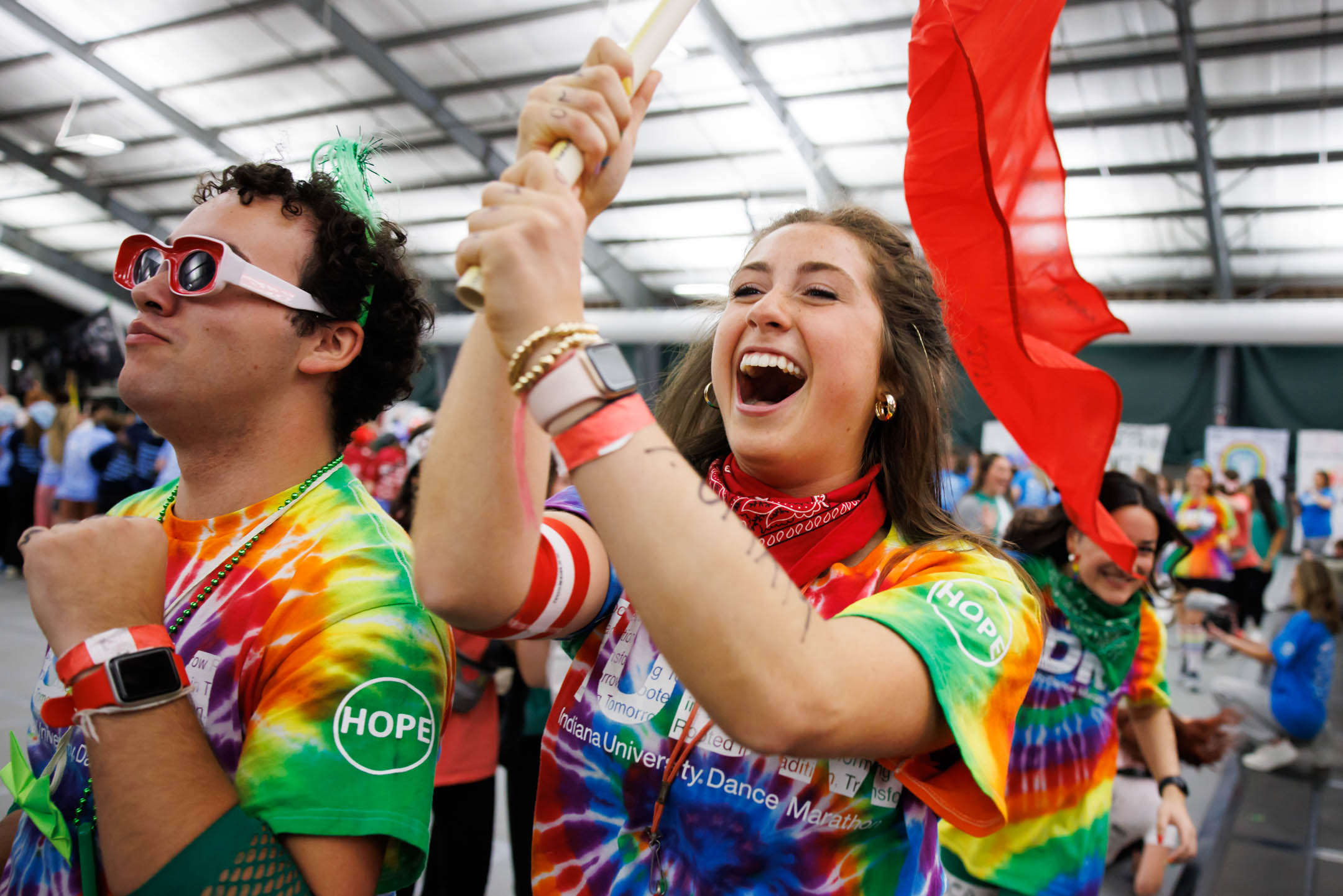 Morale committee members run through the crowd before the opening ceremony of the Indiana University Dance Marathon in the IU Tennis Center on Friday, Oct. 28, 2022. (James Brosher/Indiana University)